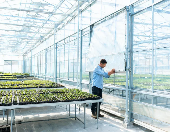 Operator reviewing greenhouse access